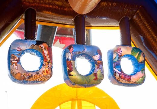 Buy shooting combo pirate bounce house covered, with cannon game and slide for kids. Order inflatable bounce houses online at JB Inflatables America