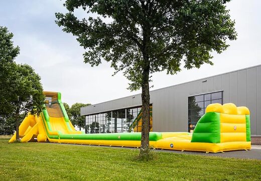 Opblaasbare super grote glijbaan van 46 meter in het groen met geel kopen