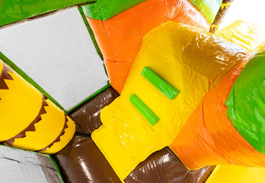 Bouncy castle Multiplay in Dinoworld theme with slide order for children. Buy inflatable bouncy castles online now at JB Inflatables America