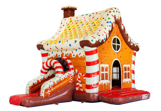 Indoor bouncy castle with slide decoration resembling a gingerbread house, red white brown