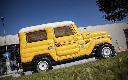 Personalized Toyota Land Cruiser Autobedrijf van der Linde bounce houses made in your own corporate identity at JB Promotions America. Order online custom promotional bounce houses in all shapes and sizes